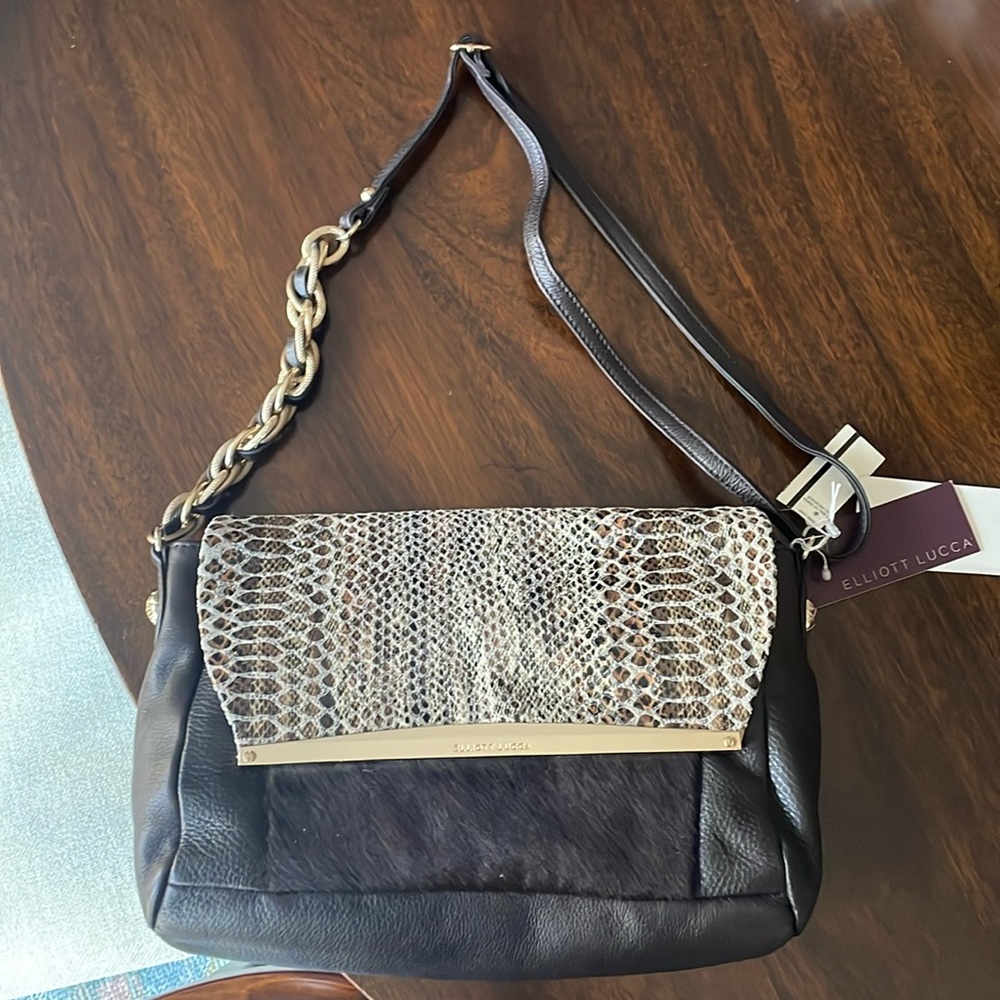 Elliot Lucca shoulder bag. Snack skin print with fur detailing. Brown leather.